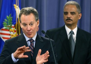 New York Attorney General Eric Schneiderman (L) speaks whille Attorney General Eric Holder listens during a news conference at the Justice Department on January 27th, 2012.