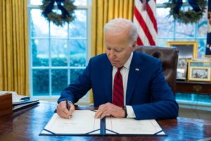 President Biden signing the Speak Out Act.